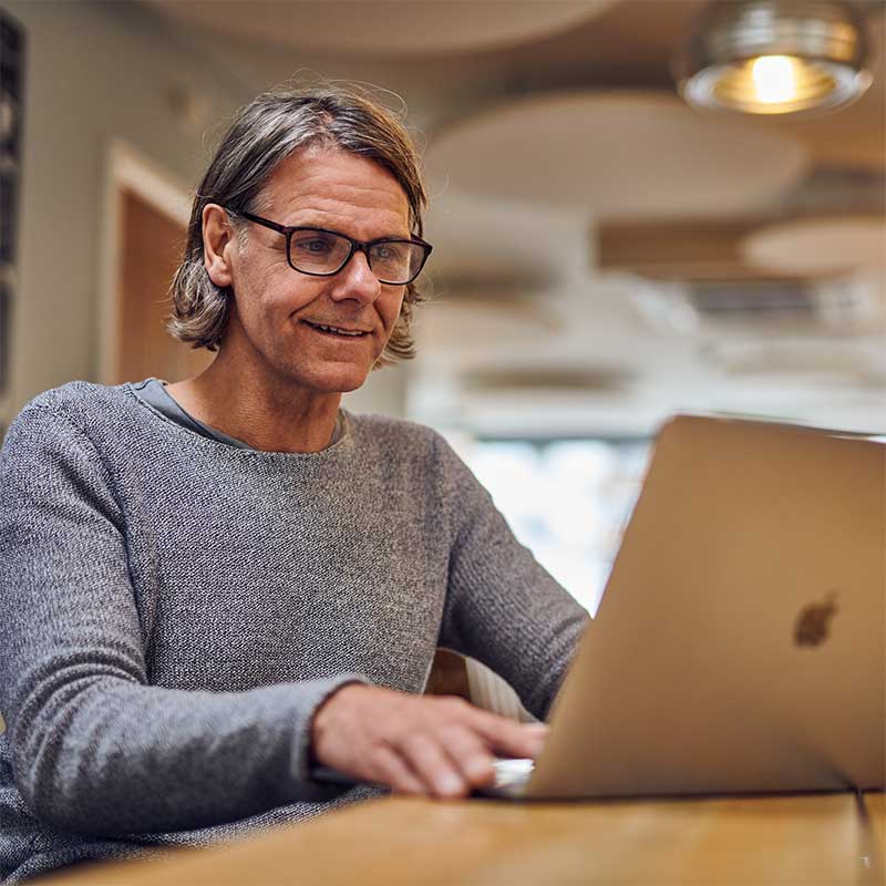 A person looking at a laptop