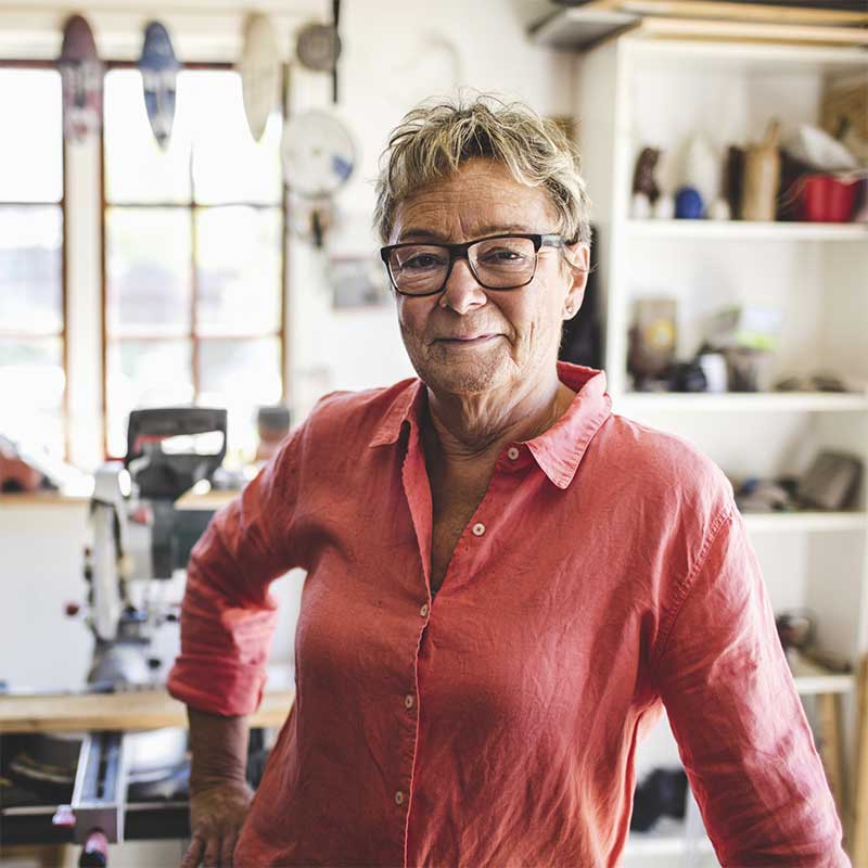 Woman in a pink shirt and glasses