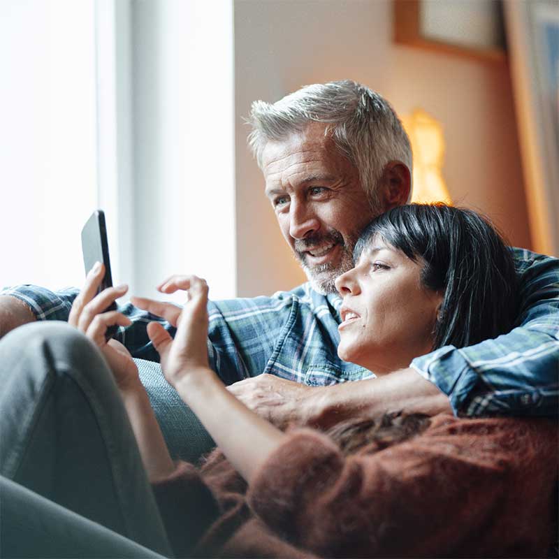 Couple browsing a mobile phone together