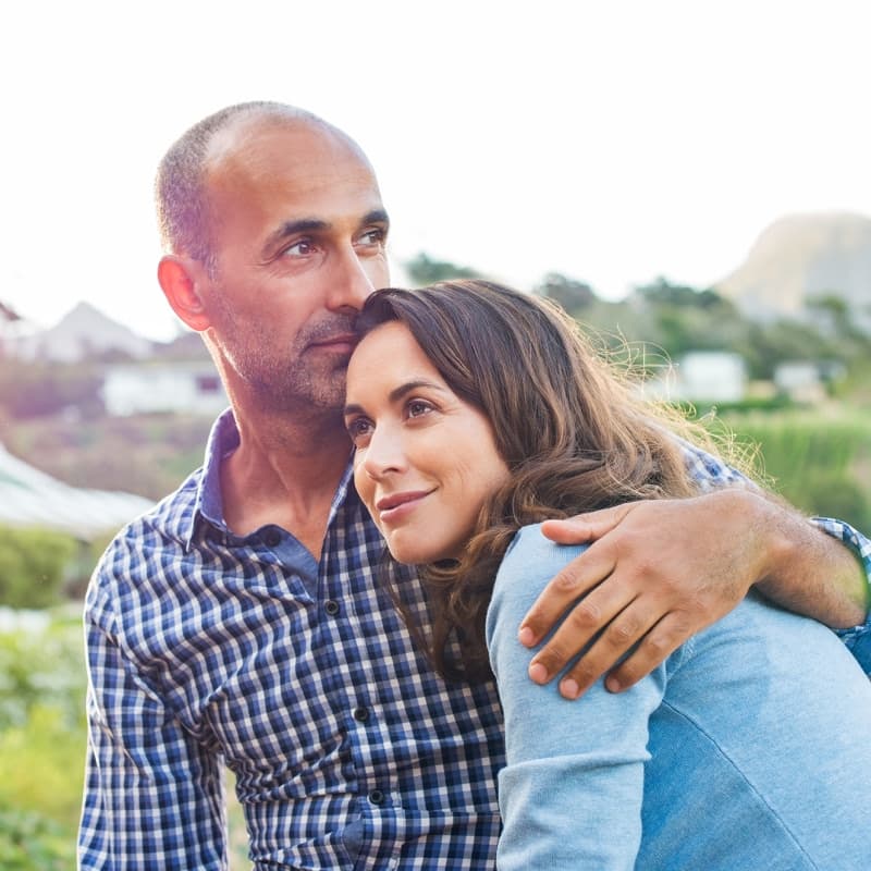 Man hugging a woman