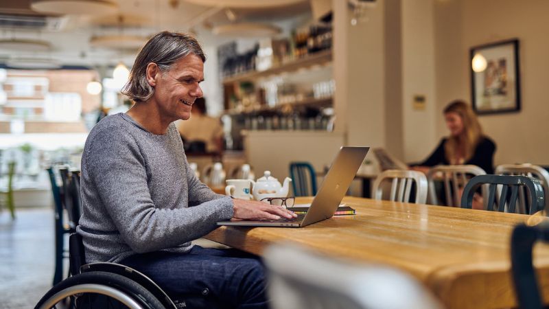 Man sitting at desk with laptop